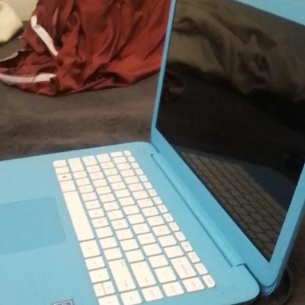 Blue Laptop with White Keyboard